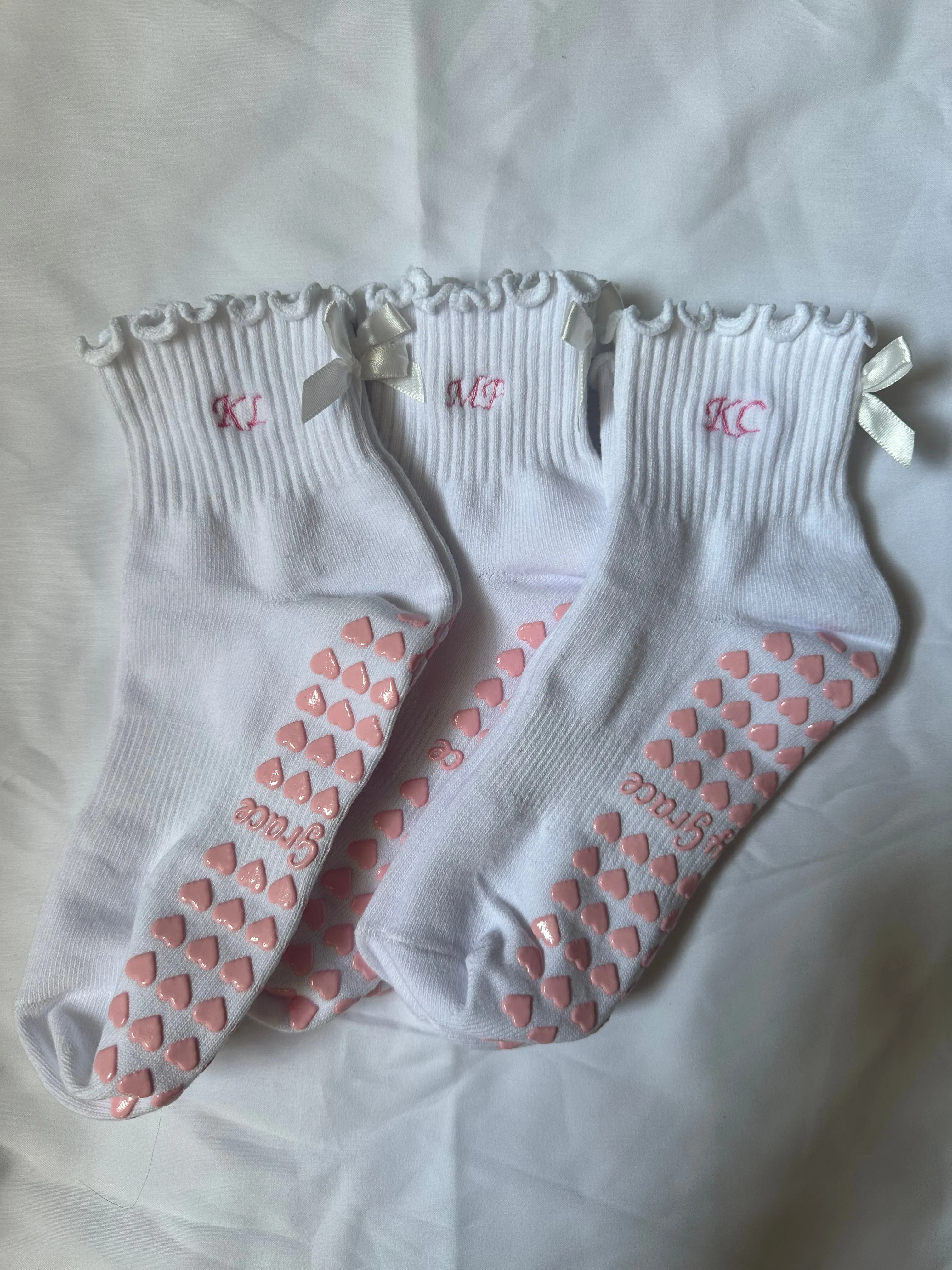 Custom initial white ruffle & white bow embroidered grip sock with pink heart grips